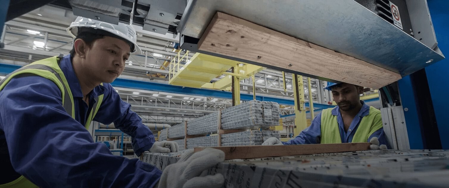 Gulf Extrusion plant workers handling aluminium profiles