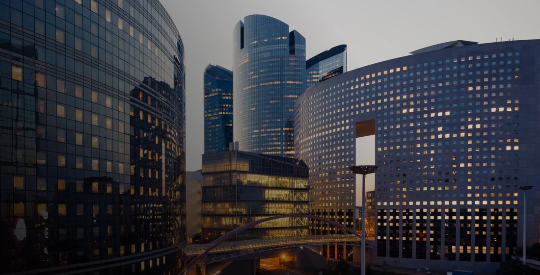 Glass and aluminium office towers at dusk